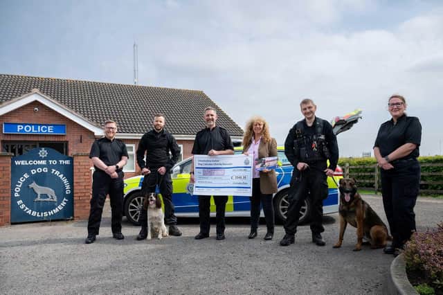 Lincolnshire Police Dosg Section present over £2,000 to the NFRSA and founder Lady Bathurst.